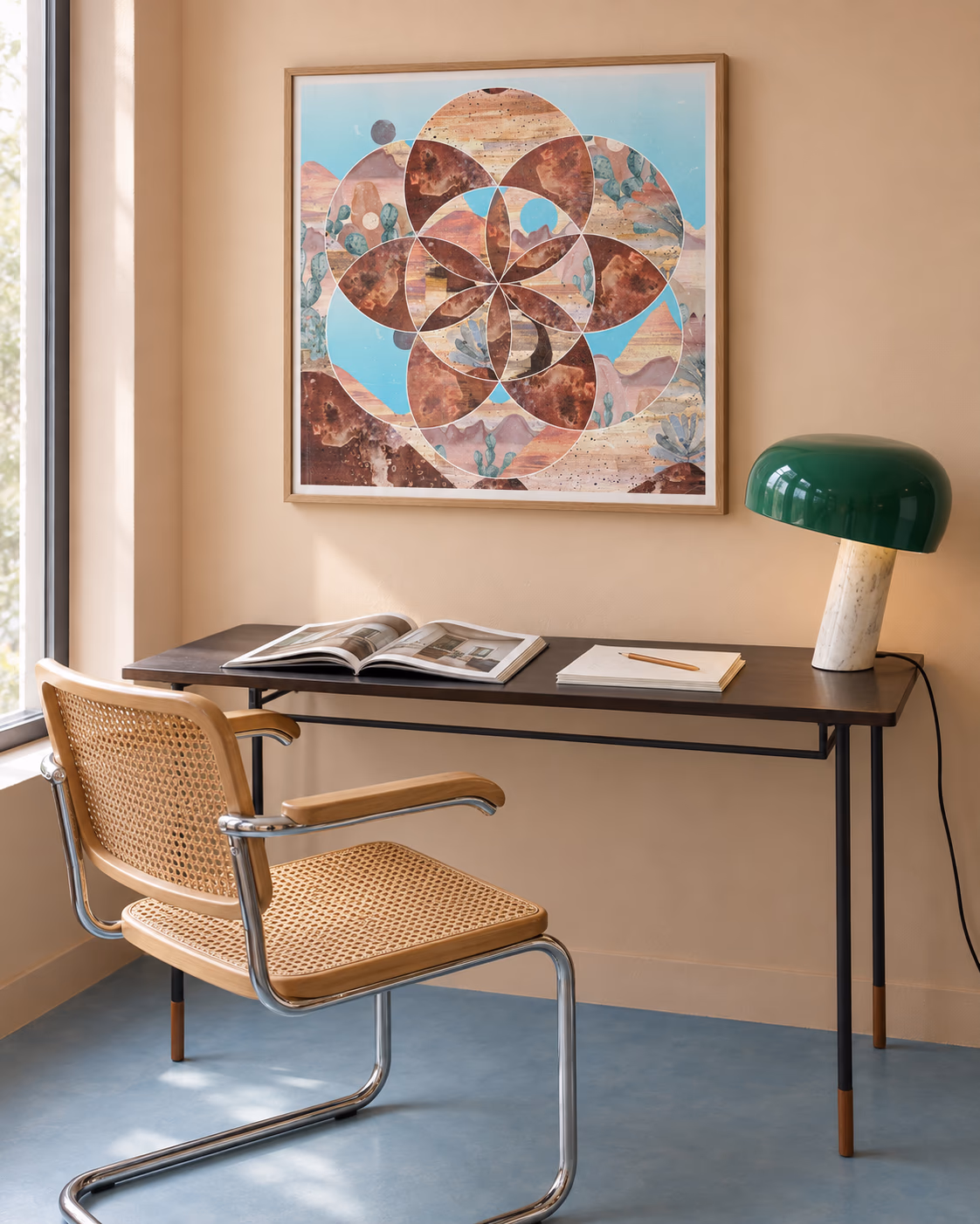 Desert Circles by Ishtar Bäcklund Dakhil framed above a desk in a peach study