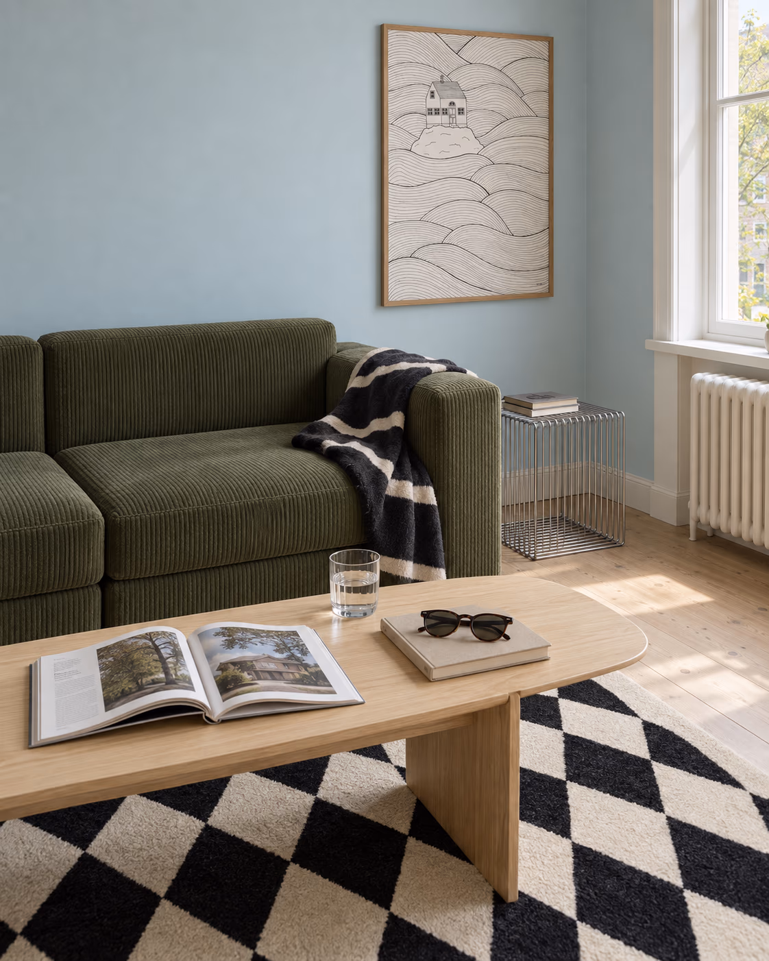 Small House Big Ocean by Hedvig Wallin framed in a reading corner