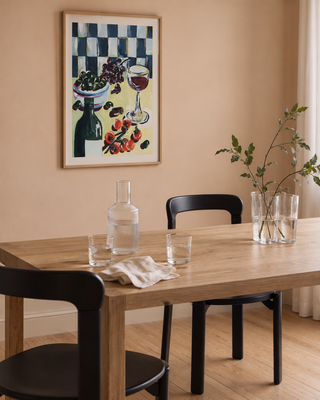 Vinkveld by Sia Siamos framed above a dining table against a peach wall