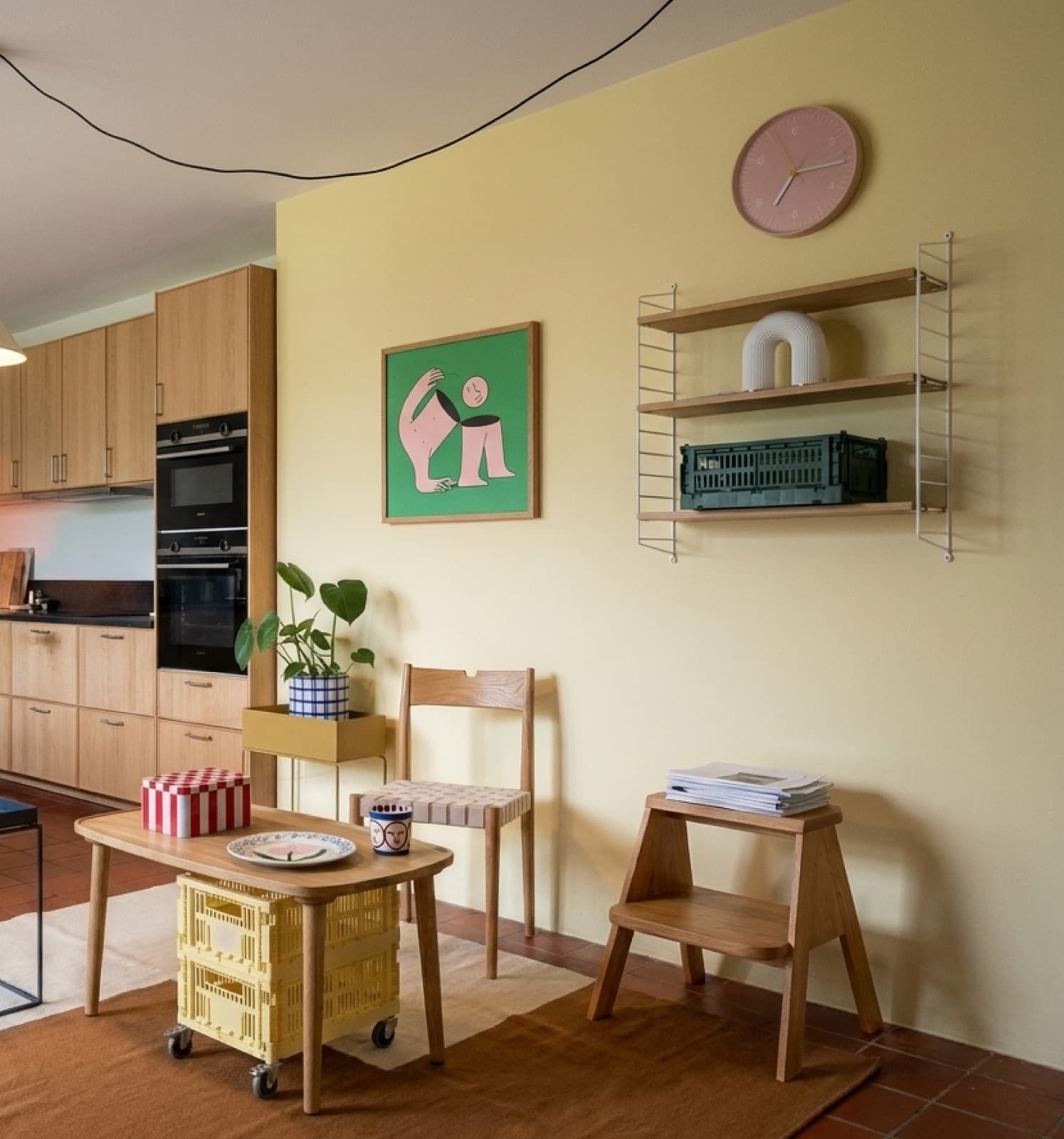 Half Man on a green sideboard in a warm yellow kitchen corner